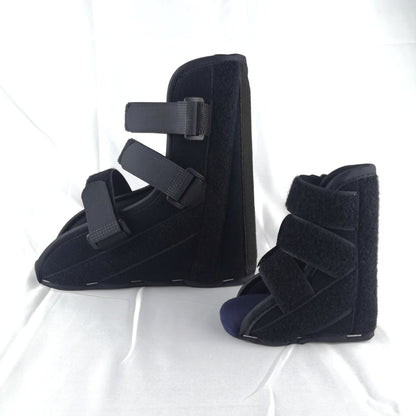 Black support boots displayed together showing structured ankle and foot support shape