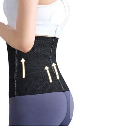 Black postpartum belly support belt worn on model, showing wraparound abdominal and waist support.