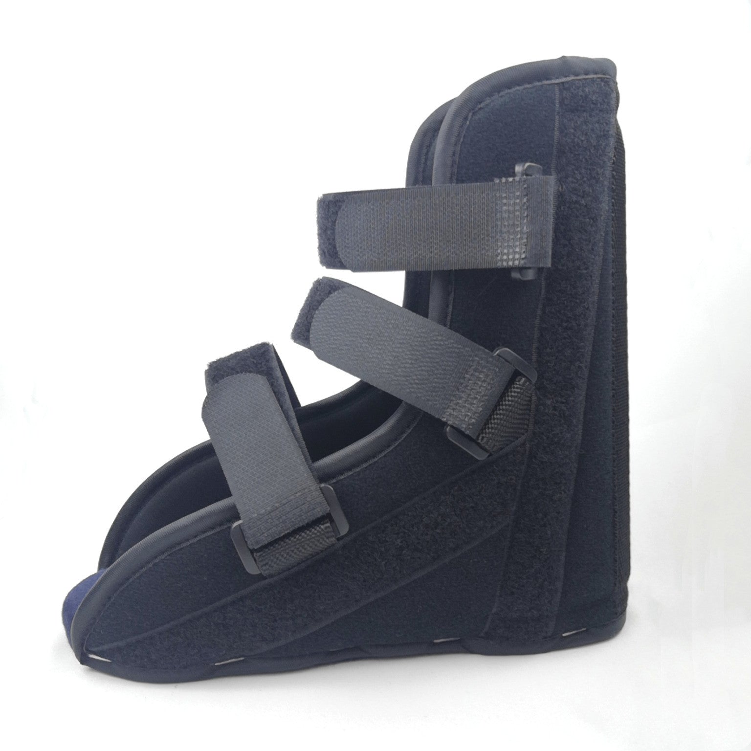 Two views of adjustable black foot support splint boot on white background