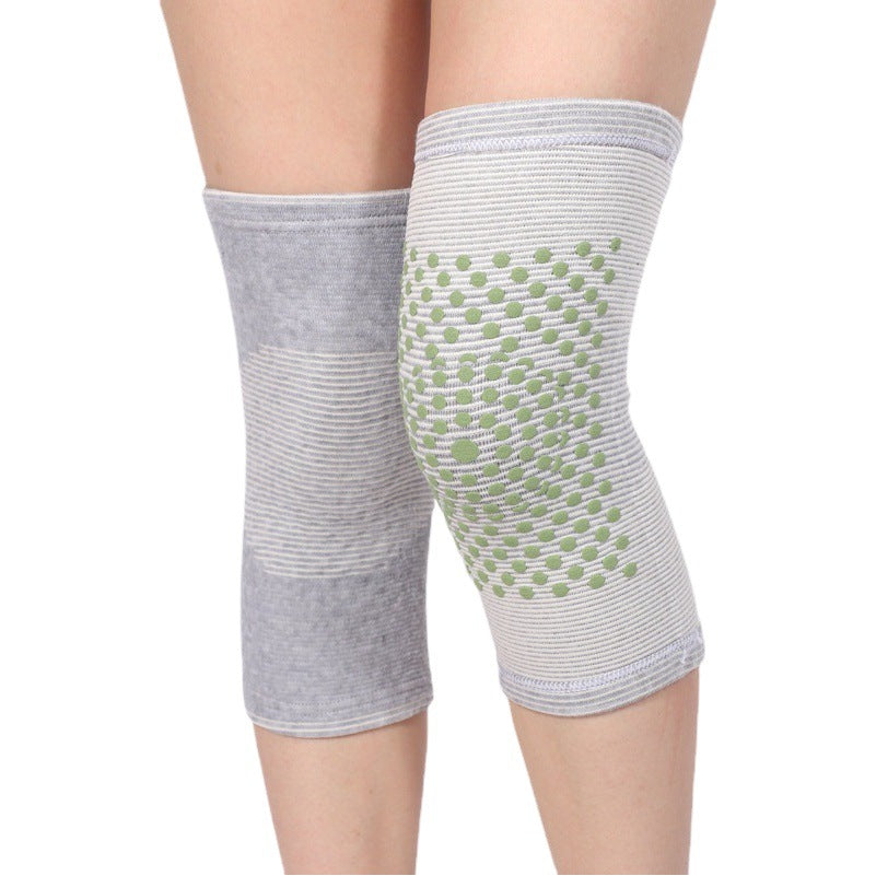 Grey warming knee support sleeve worn on leg with anti-slip grip pattern