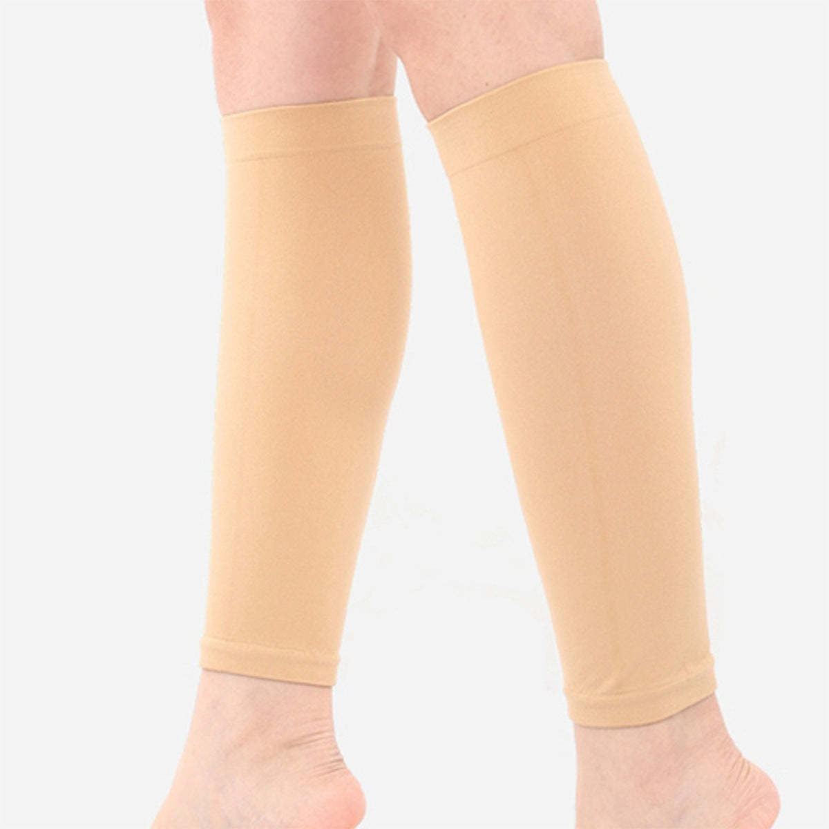 Skin tone lower leg support sleeves shown on both calves
