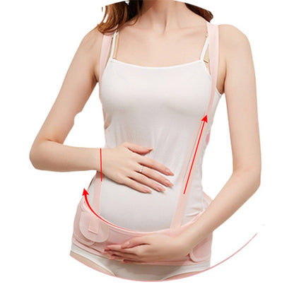 Pink maternity support belt with adjustable straps on a white background