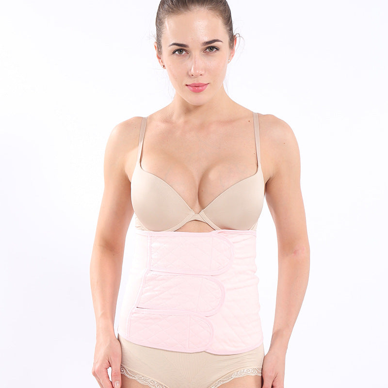 Close-up of quilted postpartum support belt with wrap overlap detail